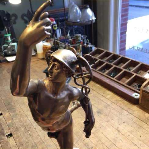 Bronze Mercury holding his caduceus with the Zephyrus head mark visible below