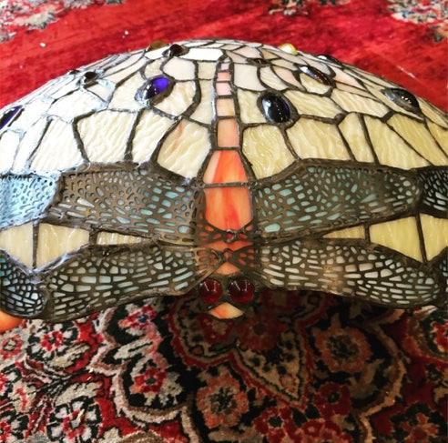 Dragonfly detail on the border of a Tiffany style leaded glass shade