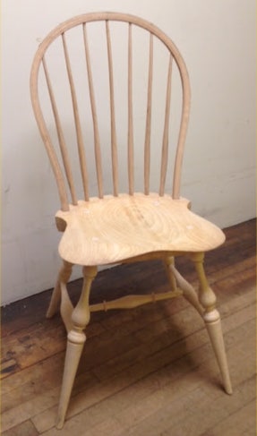 Handmade unfinished bow-back Windsor chair with turned legs and spindle back